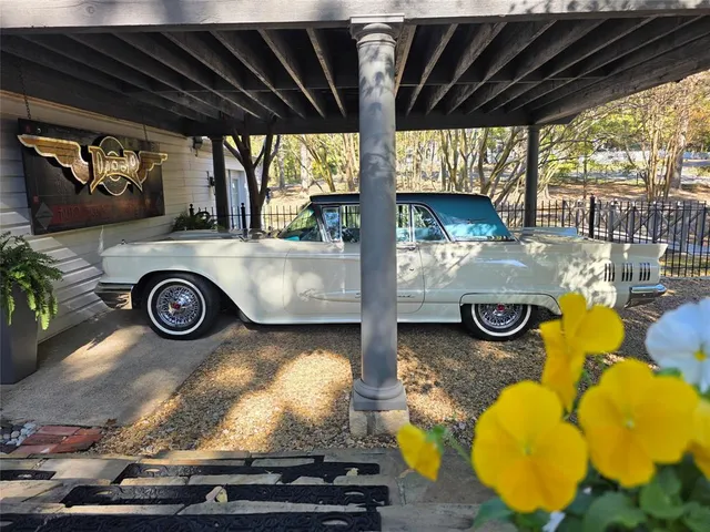 a view of open kitchen with a sink and a stove