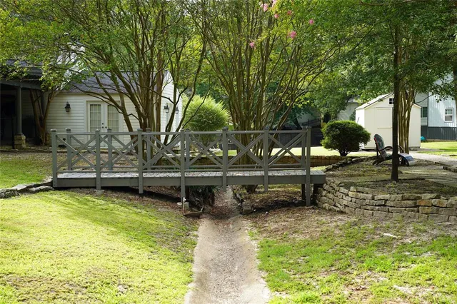 a view of a house with swimming pool and sitting area