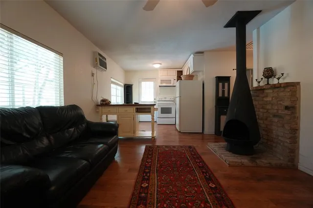 a living room with furniture and a rug