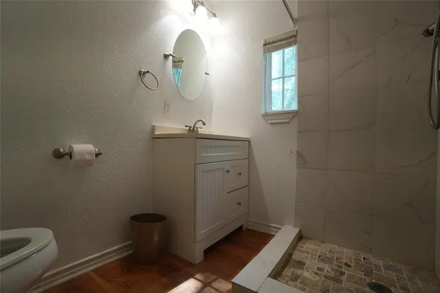 a bathroom with a sink and toilet