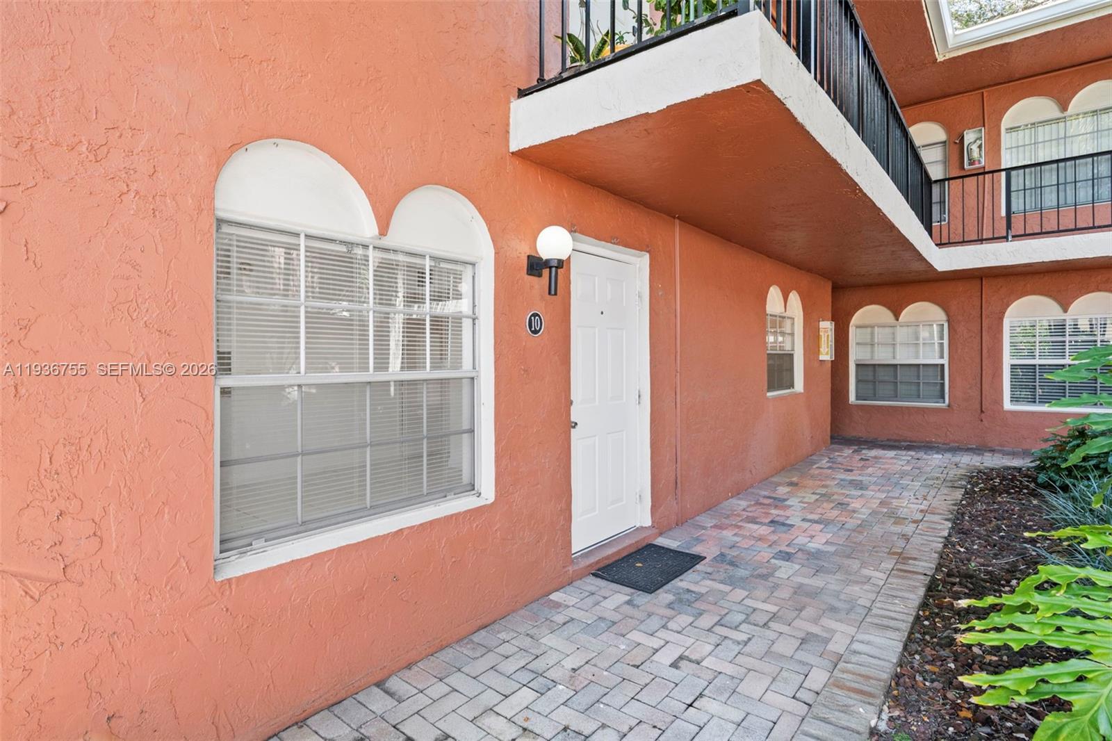 1405 Miami Road, Unit 10 Fort Lauderdale, FL 33316 - Photo 3 of 14 a front view of a house with a yard