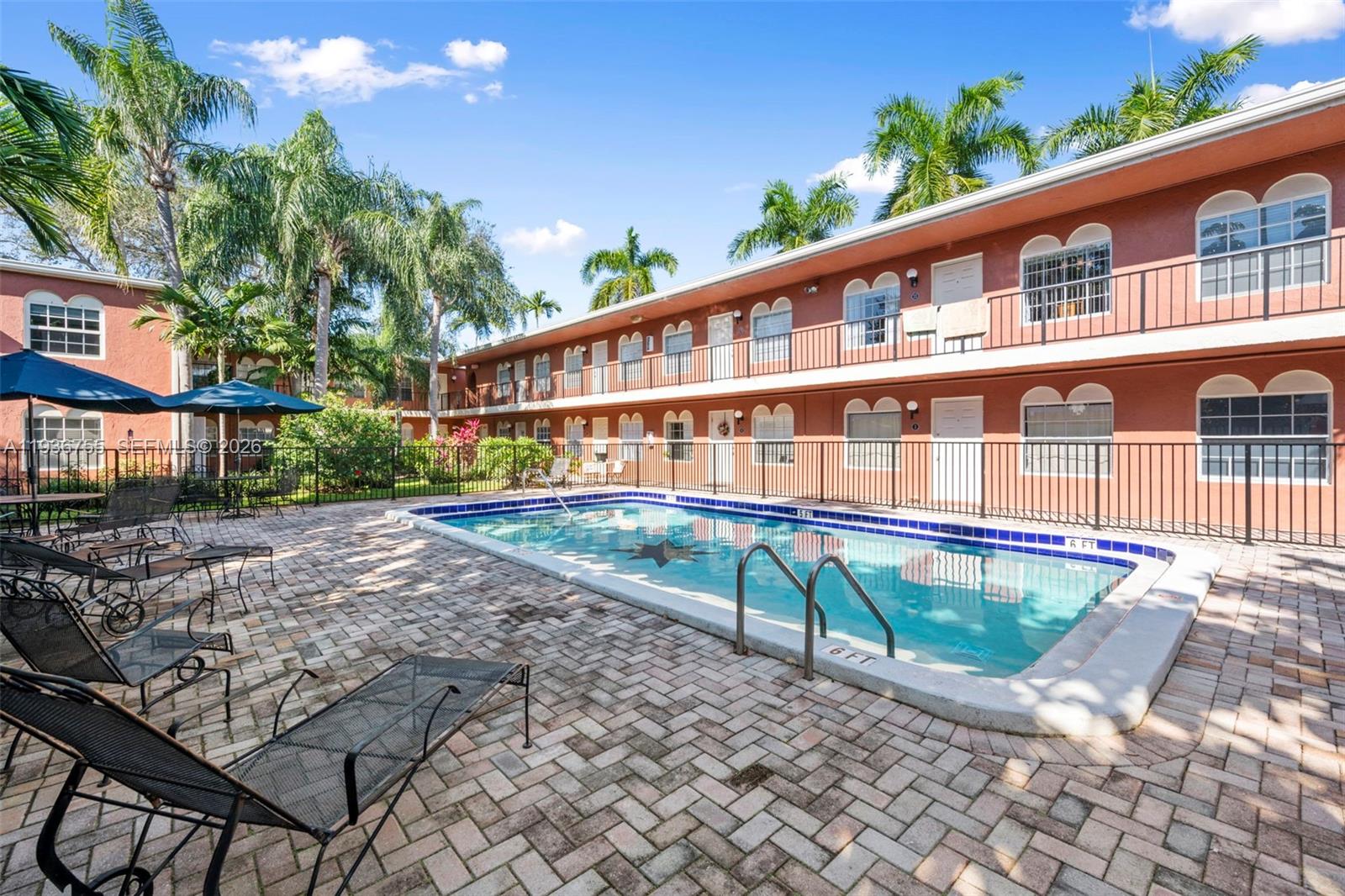 1405 Miami Road, Unit 10 Fort Lauderdale, FL 33316 - Photo 4 of 14 a view of a house with backyard and sitting area