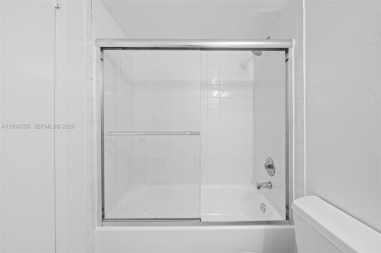 1405 Miami Road, Unit 10 Fort Lauderdale, FL 33316 - Photo 9 of 14 a bathroom with a glass shower door
