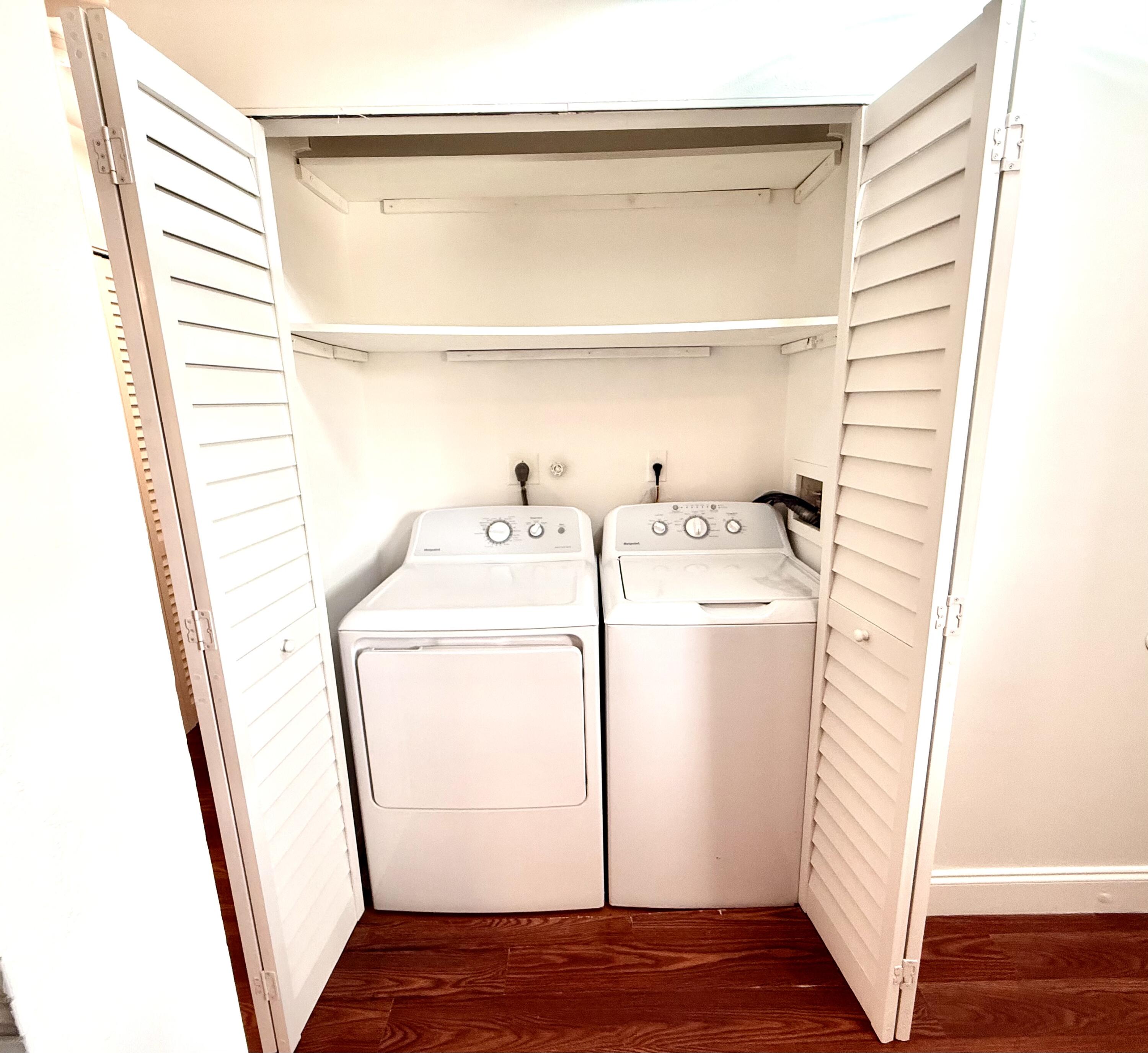 9503 Boca Cove Circle, Unit 610 Boca Raton, FL 33428 - Photo 15 of 16 a utility room with dryer and washer