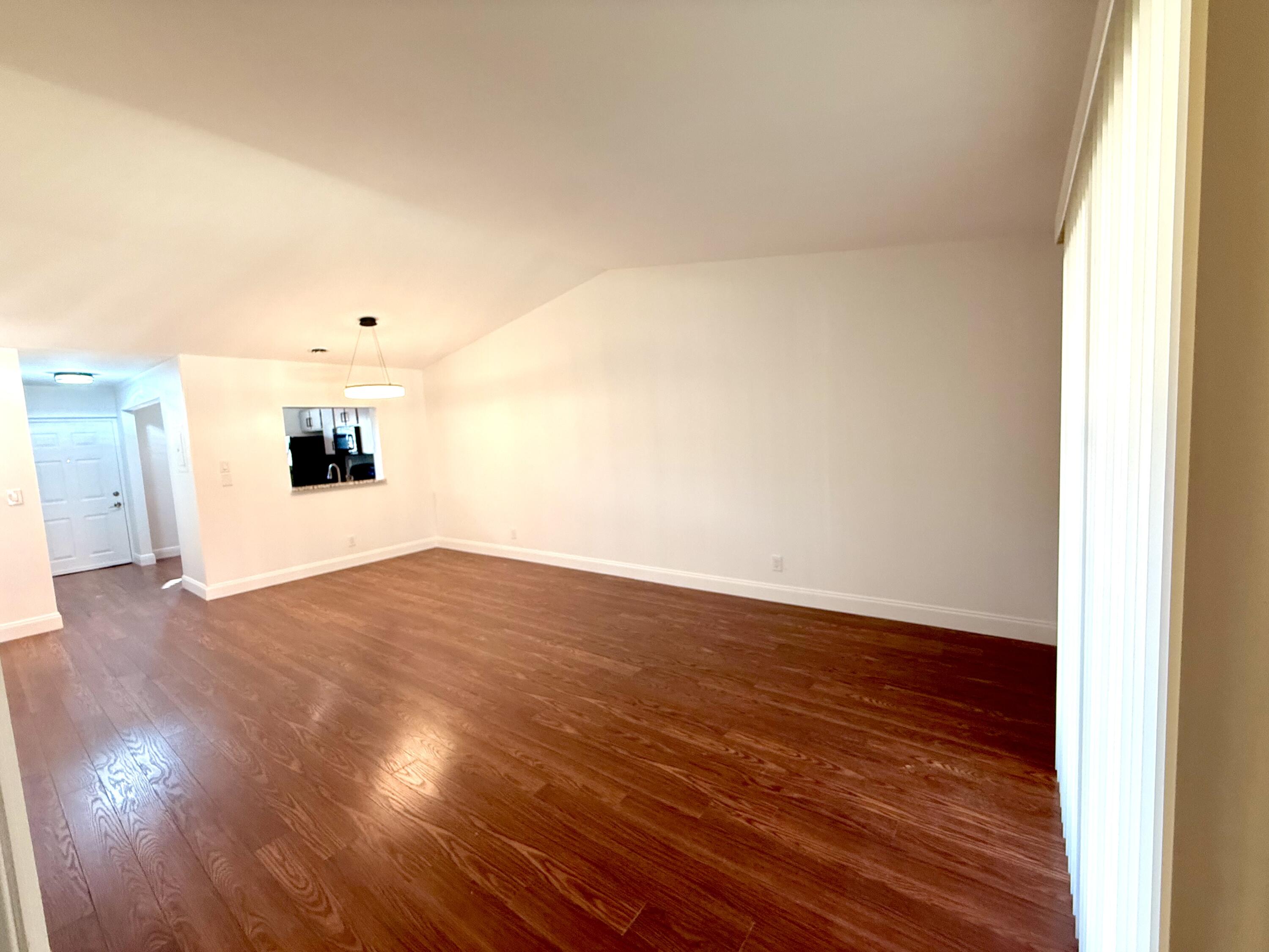 9503 Boca Cove Circle, Unit 610 Boca Raton, FL 33428 - Photo 3 of 16 a view of empty room with wooden floor