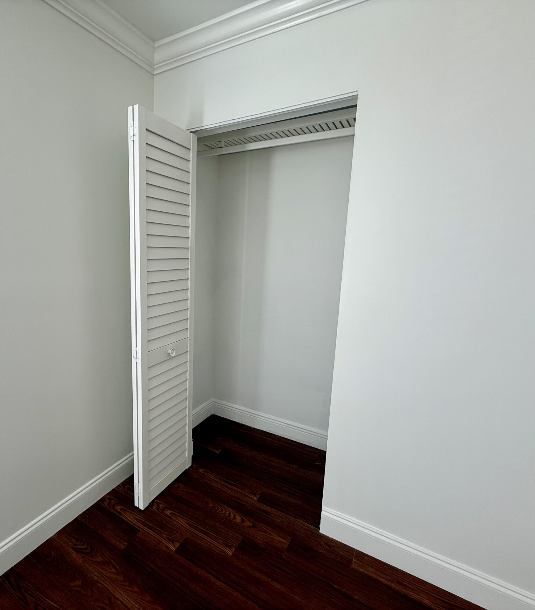 9503 Boca Cove Circle, Unit 610 Boca Raton, FL 33428 - Photo 6 of 16 a view of an empty room with wooden floor