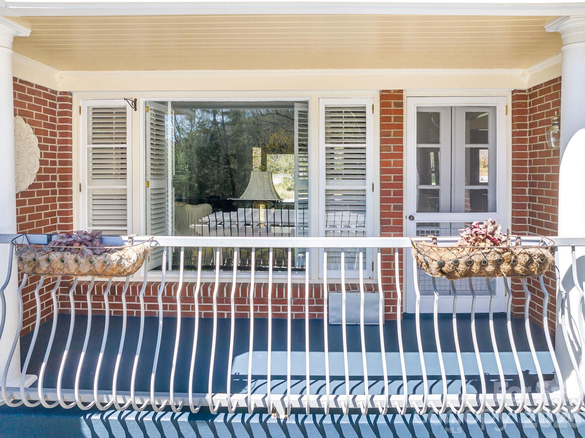 4 Dogwood Road Asheville, NC 28804 - Photo 17 of 48 a view of a balcony with a floor to ceiling window
