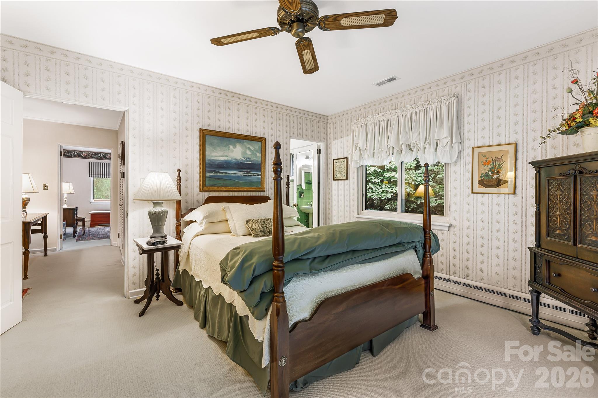 4 Dogwood Road Asheville, NC 28804 - Photo 29 of 48 a bedroom with a bed a mirror and lamp