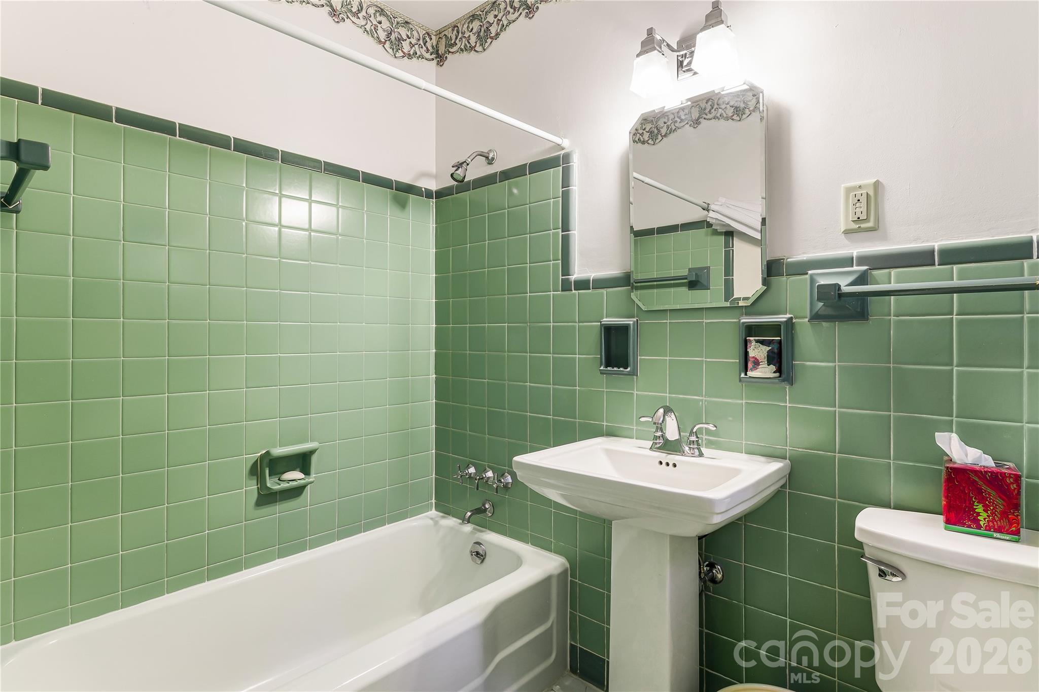 4 Dogwood Road Asheville, NC 28804 - Photo 30 of 48 a bathroom with a sink mirror toilet and bathtub