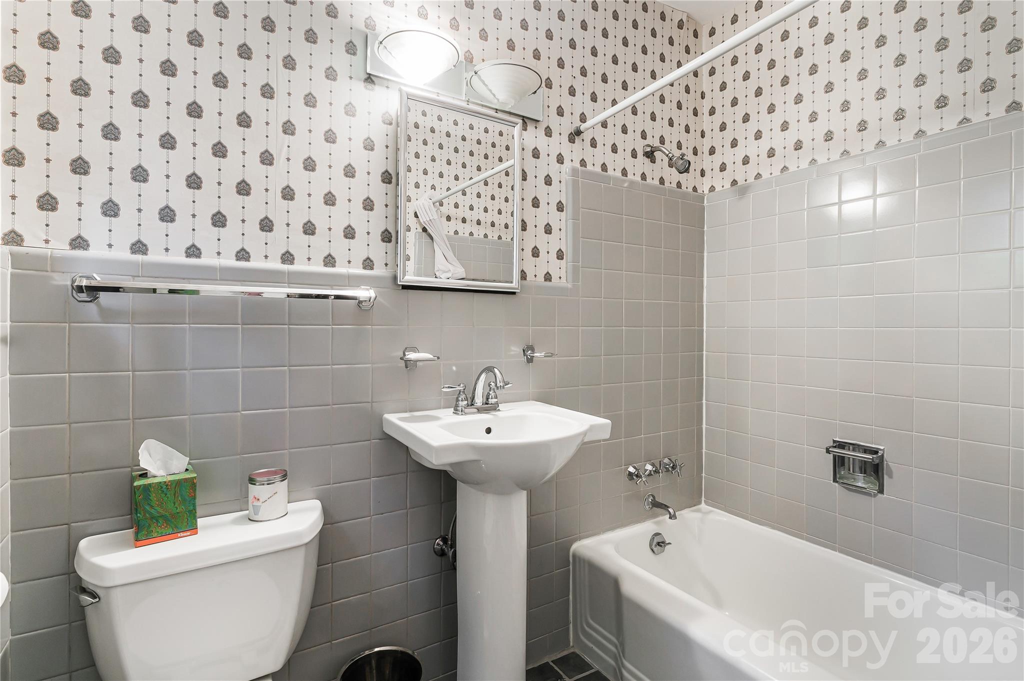 4 Dogwood Road Asheville, NC 28804 - Photo 31 of 48 a bathroom with a sink toilet and shower