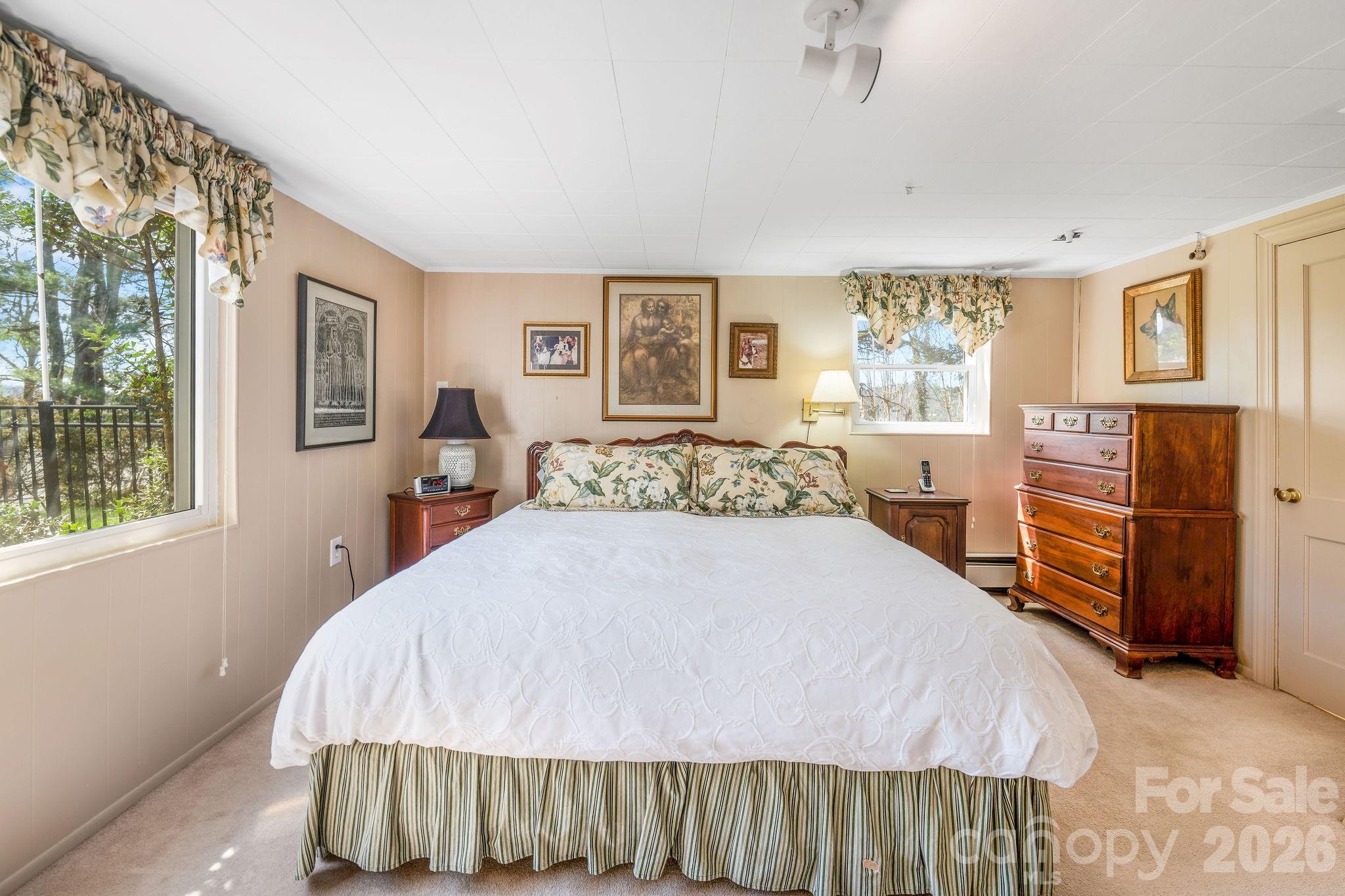 4 Dogwood Road Asheville, NC 28804 - Photo 33 of 48 a bedroom with a bed and wooden floor
