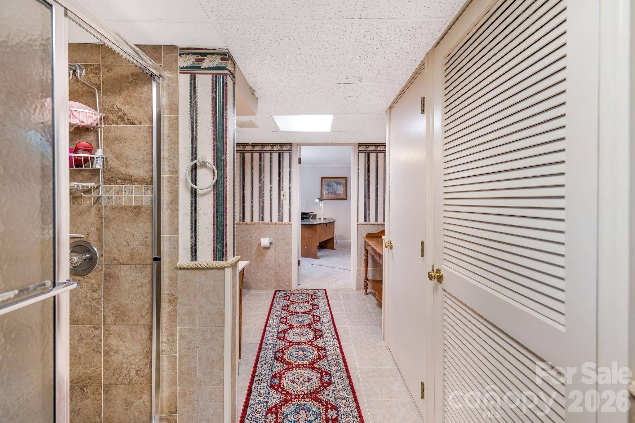 4 Dogwood Road Asheville, NC 28804 - Photo 34 of 48 a view of a hallway with wooden floor and staircase