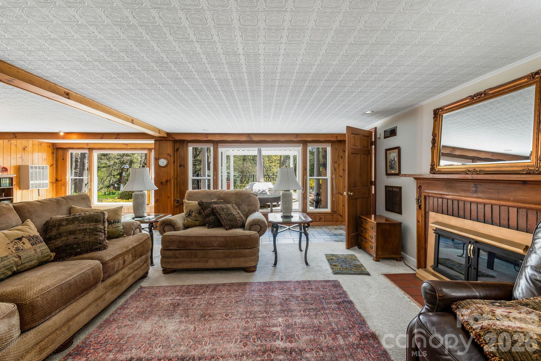 4 Dogwood Road Asheville, NC 28804 - Photo 36 of 48 a living room with furniture a flat screen tv and a fireplace