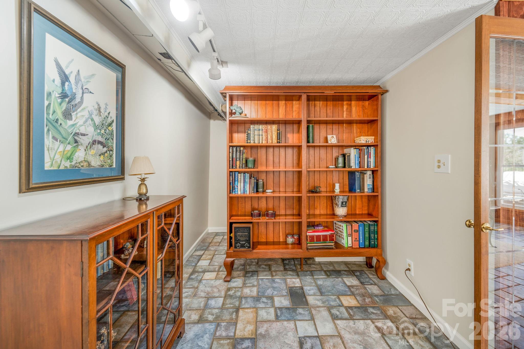 4 Dogwood Road Asheville, NC 28804 - Photo 38 of 48 a view of a hallway with paintings on the wall