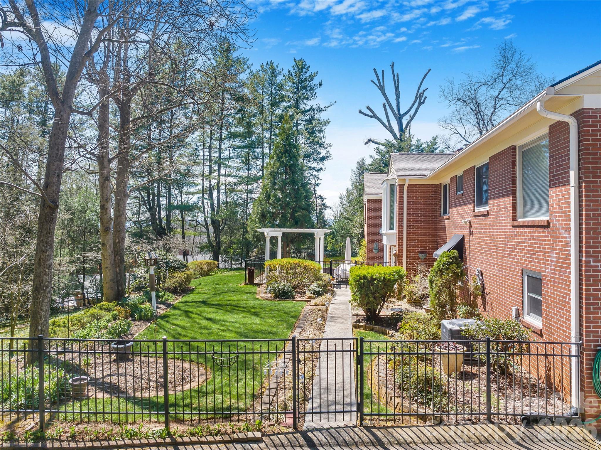 4 Dogwood Road Asheville, NC 28804 - Photo 4 of 48 a view of a house with backyard and sitting area