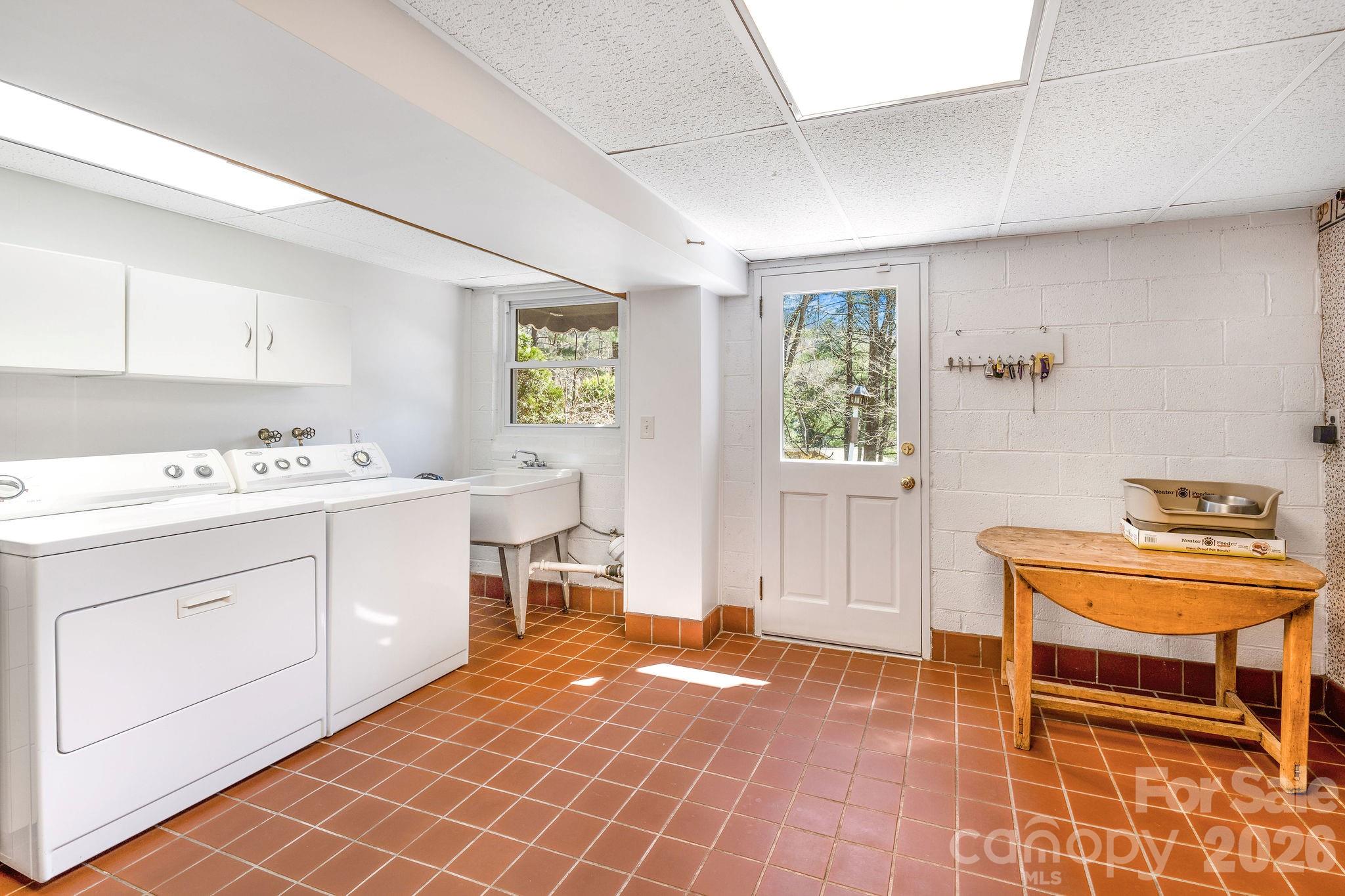 4 Dogwood Road Asheville, NC 28804 - Photo 42 of 48 a room with a chair and cabinets