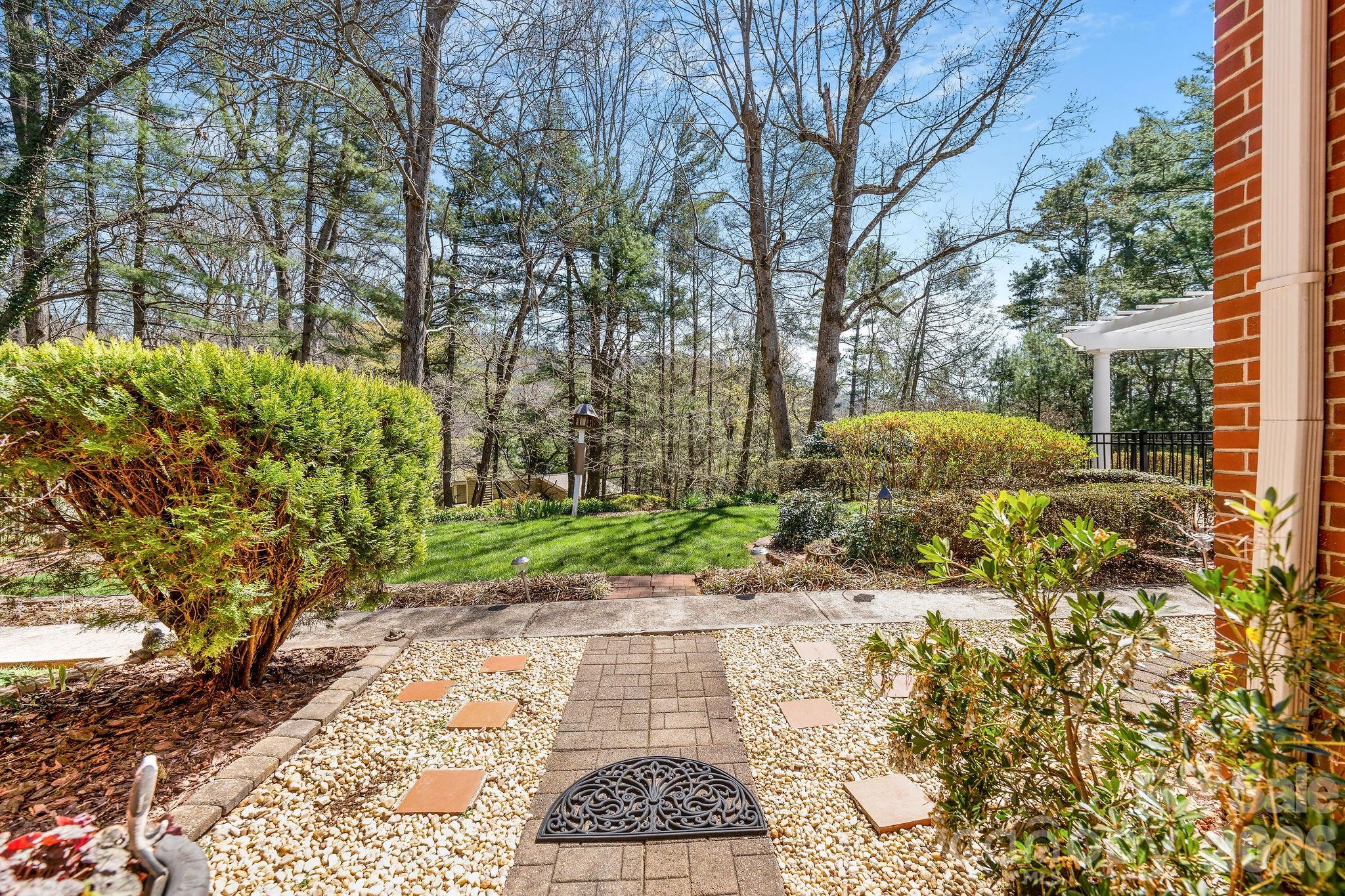 4 Dogwood Road Asheville, NC 28804 - Photo 43 of 48 a view of a pathway both side of house