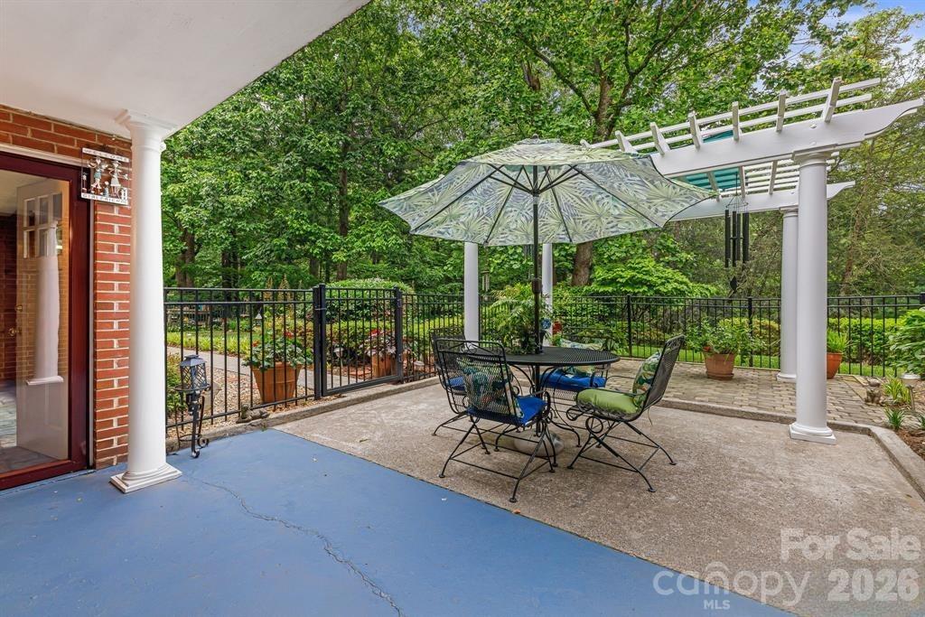 4 Dogwood Road Asheville, NC 28804 - Photo 45 of 48 a view of a chair and table in the patio