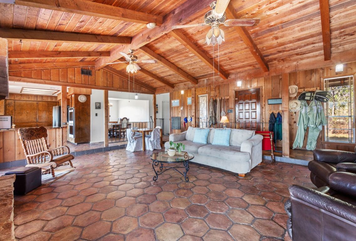 12516 Wire Road Leander, TX 78641 - Photo 12 of 40 a living room with furniture and a flat screen tv