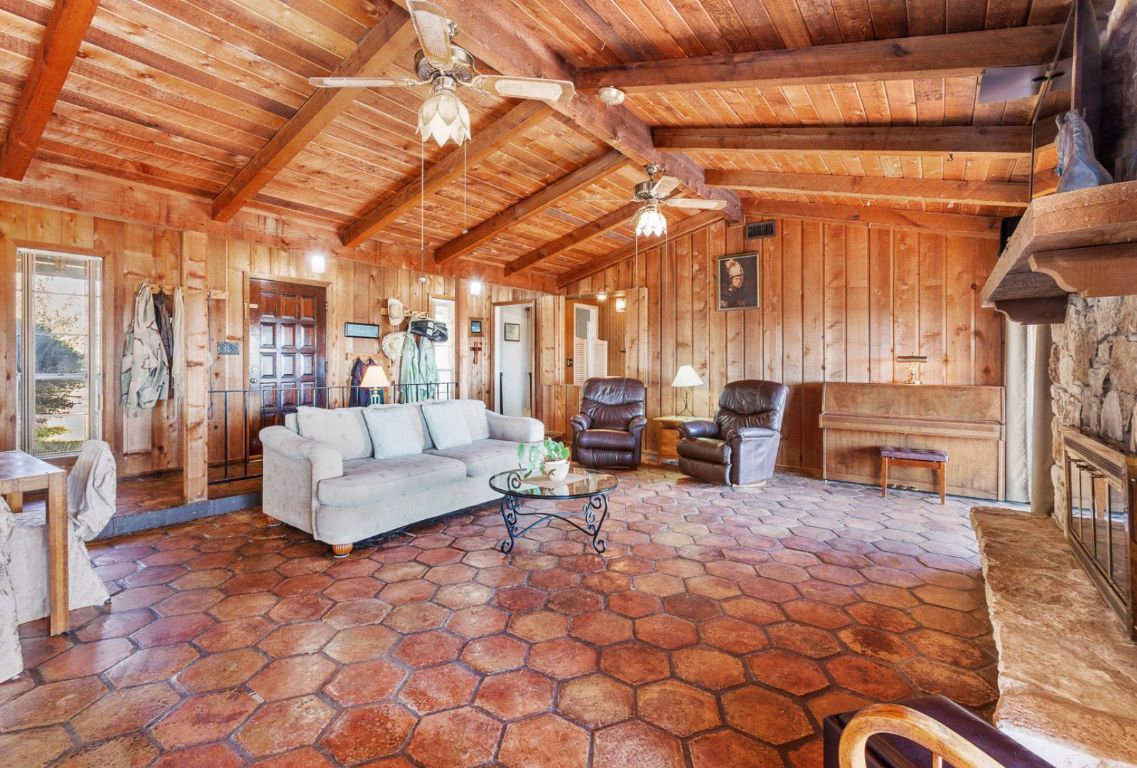 12516 Wire Road Leander, TX 78641 - Photo 13 of 40 a living room with furniture and a fireplace