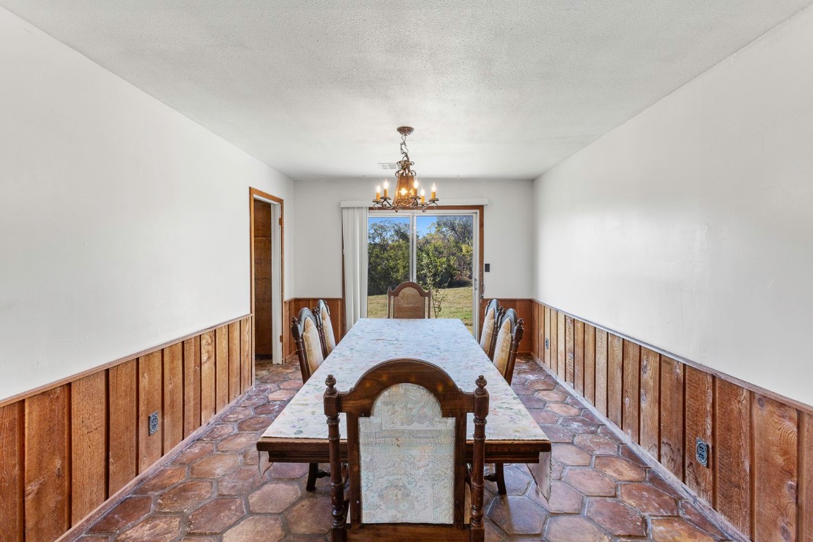 12516 Wire Road Leander, TX 78641 - Photo 15 of 40 a dining room with furniture window and outdoor view