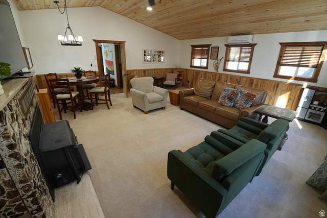 3711 North Canyon Road Provo, UT 84604 - Photo 27 of 42 Living area featuring wooden walls, wood ceiling, wainscoting, vaulted ceiling, and light carpet