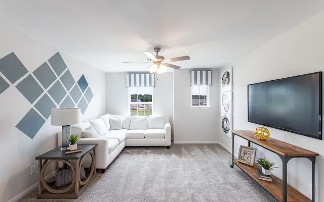 a living room with furniture and a window