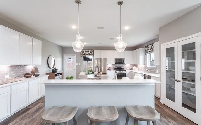 a kitchen with a sink and a stove