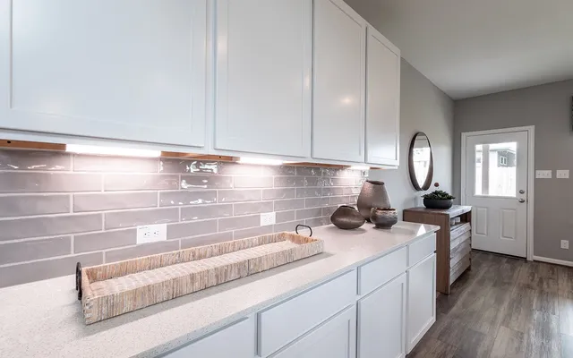 a kitchen with a stove and cabinets