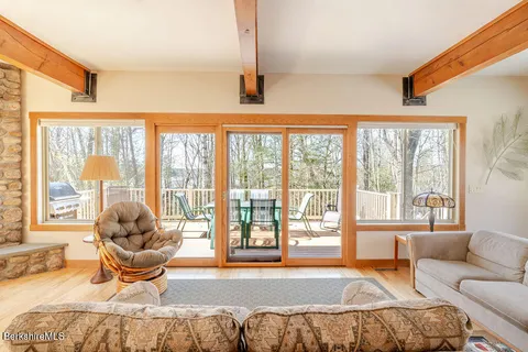 a bedroom with a bed and glass window