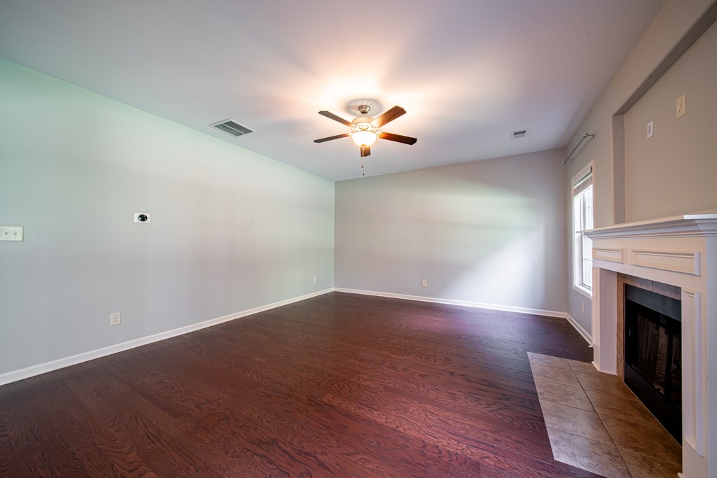 38 Pin Oak Way Hamilton, GA 31811 - Photo 12 of 50 wooden floor in an empty room with a window