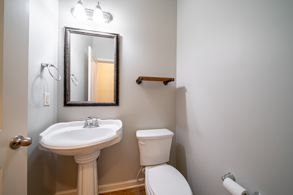 38 Pin Oak Way Hamilton, GA 31811 - Photo 16 of 50 a bathroom with a toilet sink and mirror
