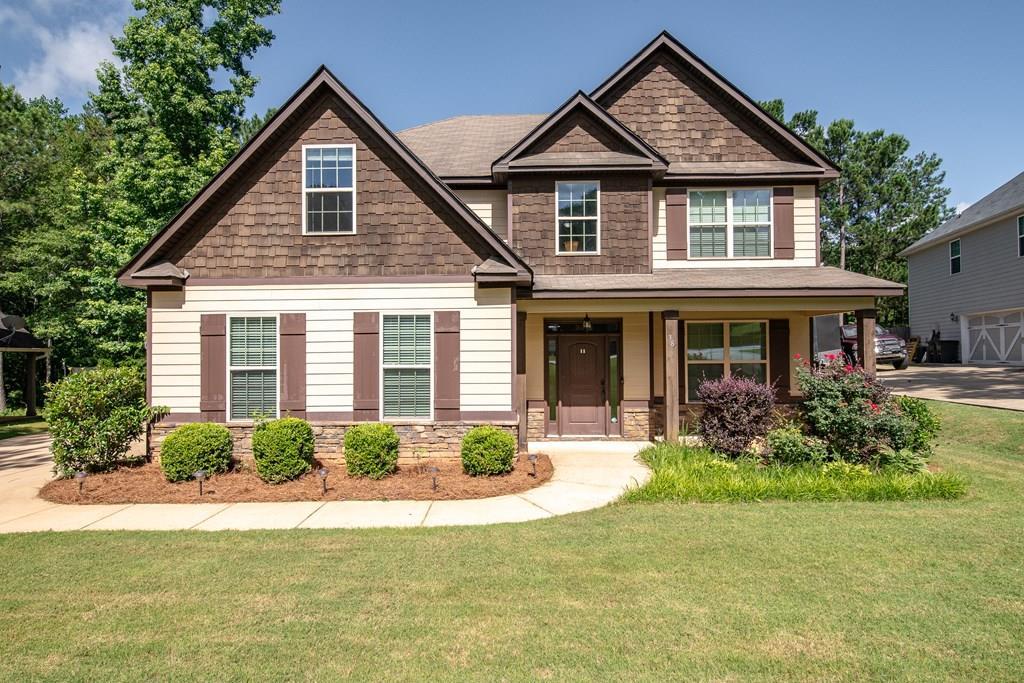 38 Pin Oak Way Hamilton, GA 31811 - Photo 2 of 50 a front view of a house with a yard