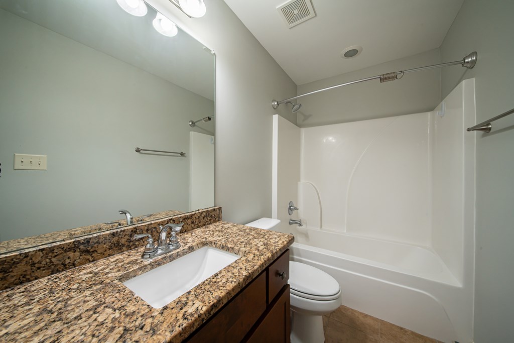 38 Pin Oak Way Hamilton, GA 31811 - Photo 26 of 50 a bathroom with a granite countertop sink toilet and shower