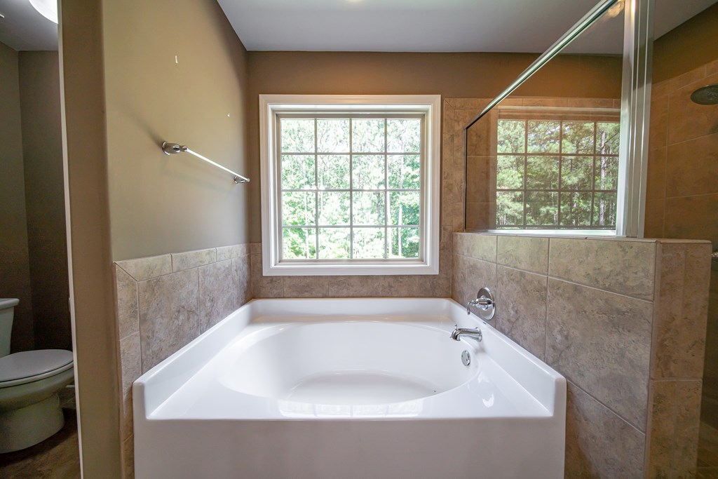 38 Pin Oak Way Hamilton, GA 31811 - Photo 36 of 50 a bathroom with a bathtub and next to a window
