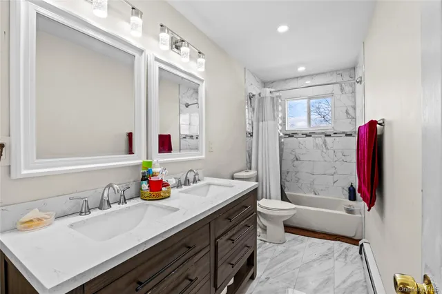 a bedroom with furniture and a flat screen tv