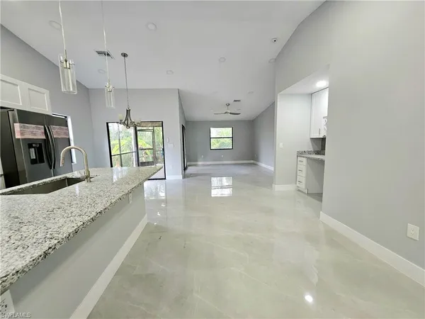 a large bathroom with a large mirror vanity and a shower