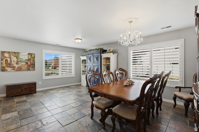 1652 West 800 South Lehi, UT 84043 - Photo 9 of 27 Dining room with stone tile flooring and suspended lighting