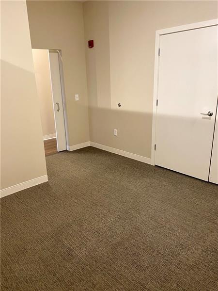 1655 Fifth Avenue, Unit 605 Pittsburgh, PA 15219 - Photo 13 of 19 an empty room with a door