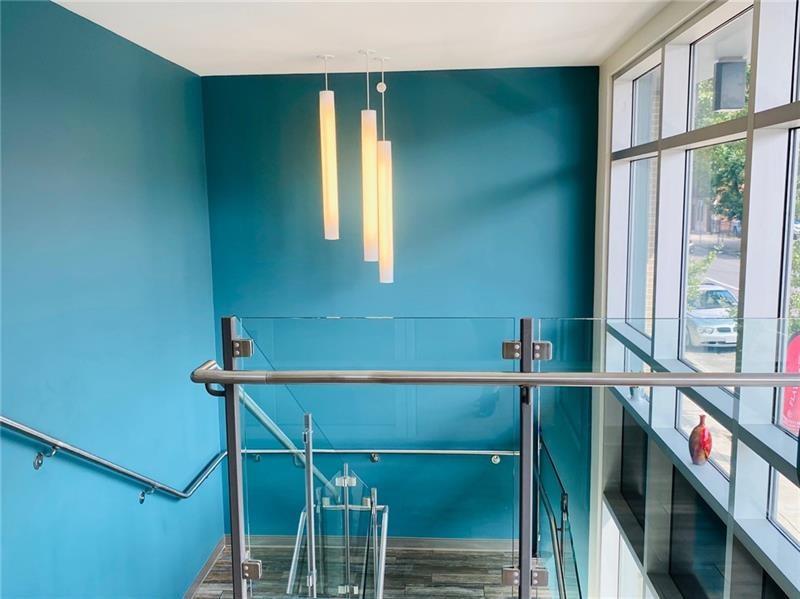 1655 Fifth Avenue, Unit 605 Pittsburgh, PA 15219 - Photo 6 of 19 a room with a large window and stairs