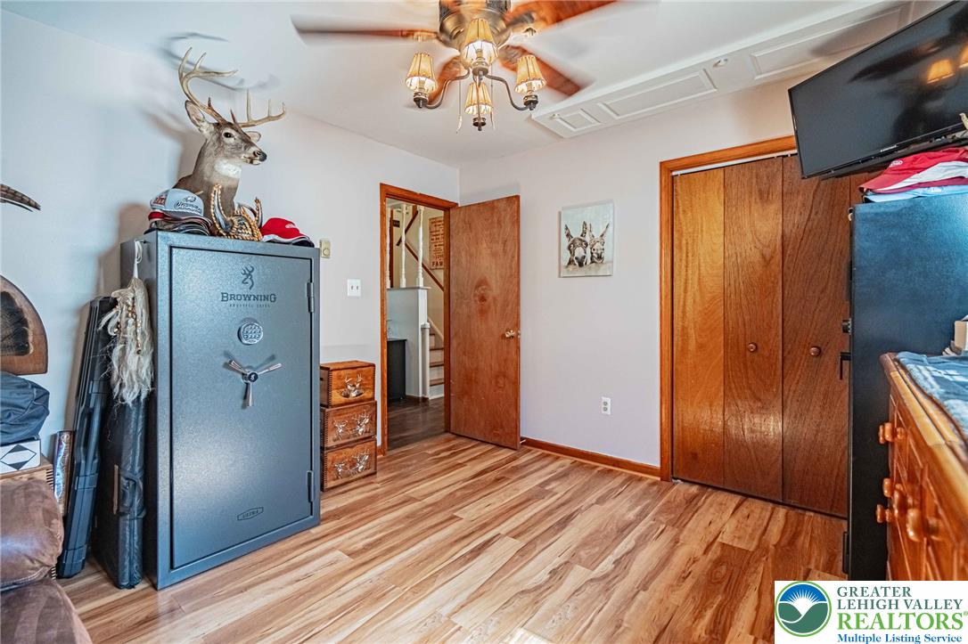 341 Lower Greenhill Road Kunkletown, PA 18058 - Photo 41 of 69 Wood flooring and ceiling fan enhance the natural warmth of this versatile interior space.