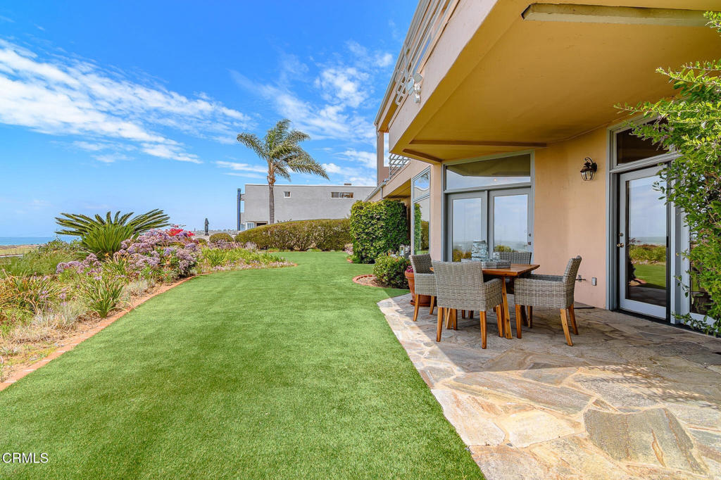 101 Rios Court Solana Beach, CA 92075 - Photo 46 of 67 a view of a patio with table and chairs and potted plants