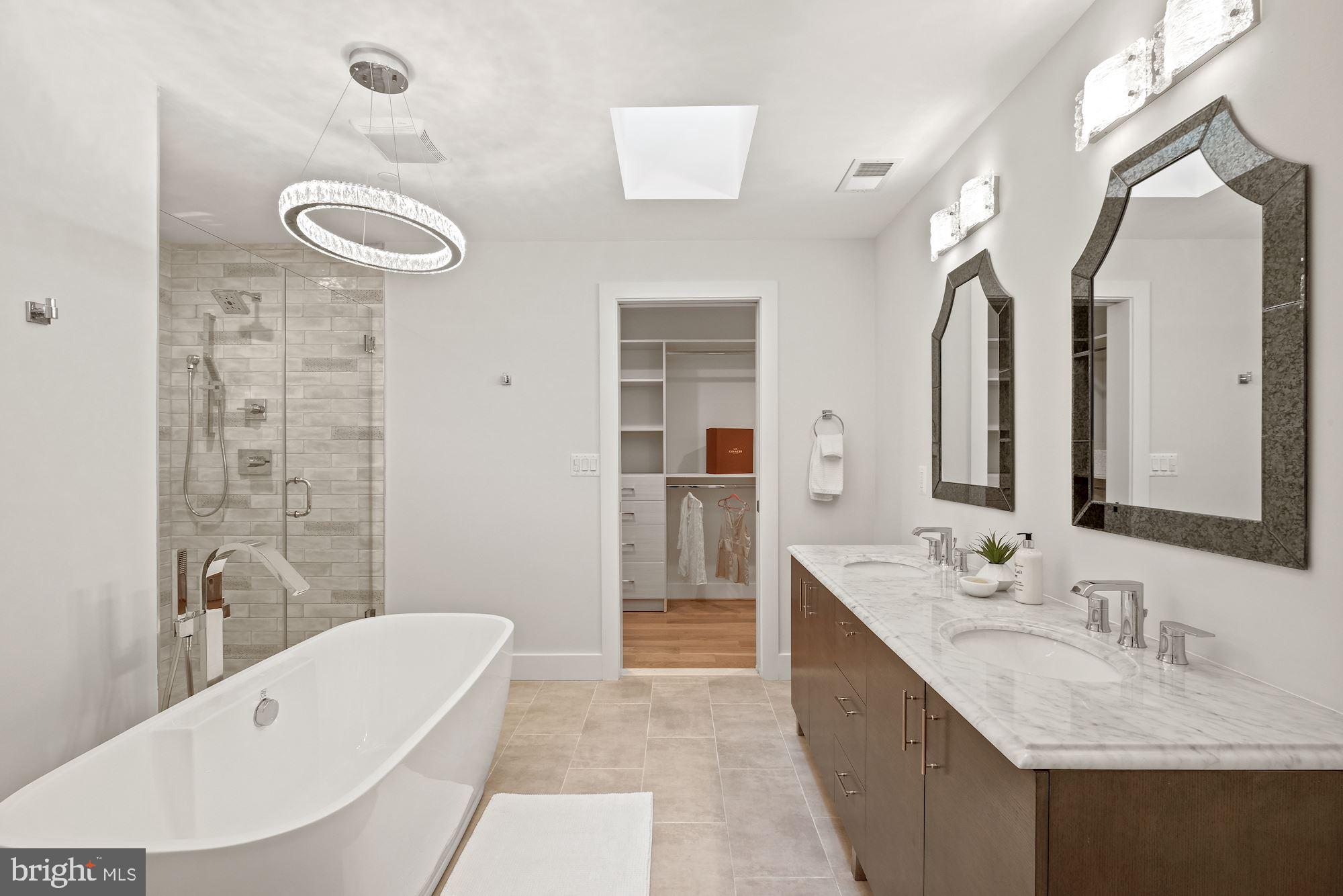 705 Silver Spring Avenue Silver Spring, MD 20910 - Photo 34 of 58 Luxurious en-suite BA features a Carrera Marble