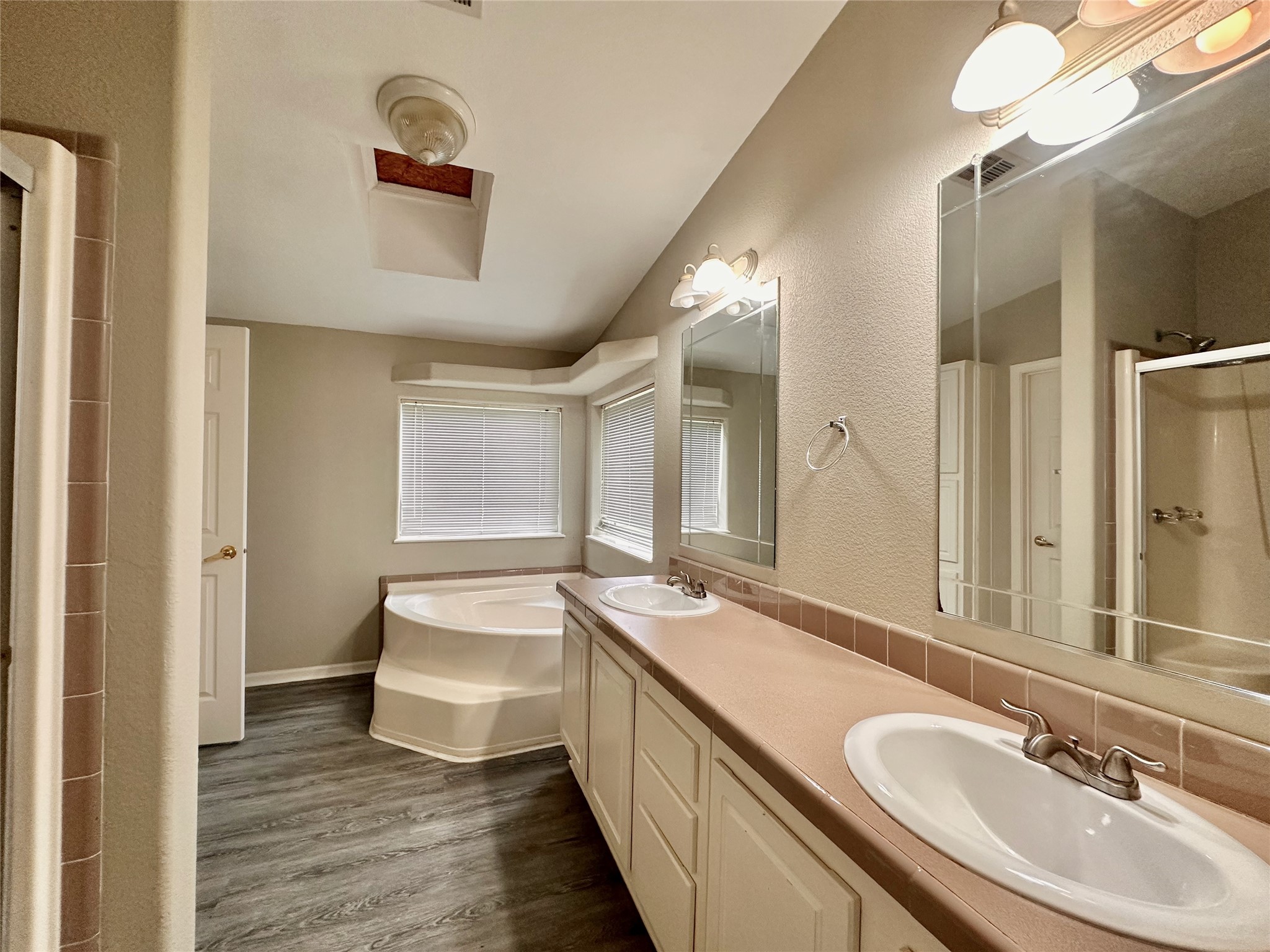 202 Main Street Fresno, TX 77545 - Photo 19 of 26 a bathroom with a double vanity sink and mirror