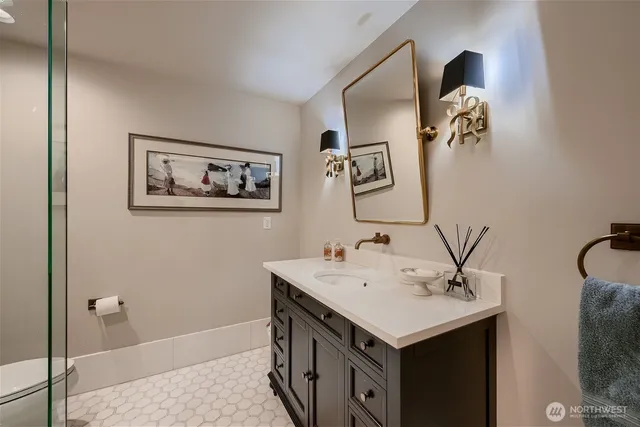 a bathroom with a sink and mirror