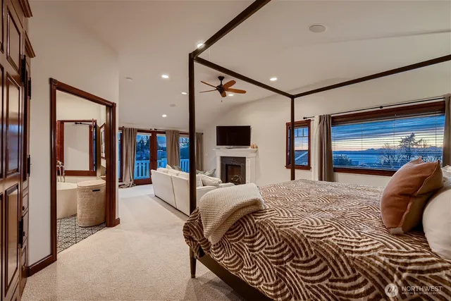 a bed room with a bed and a television