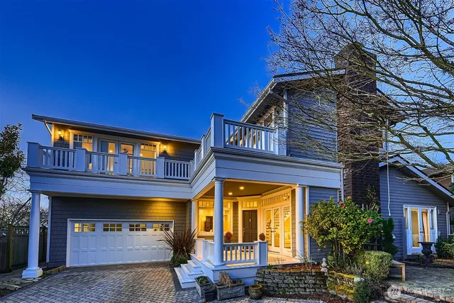 a front view of a house with large windows