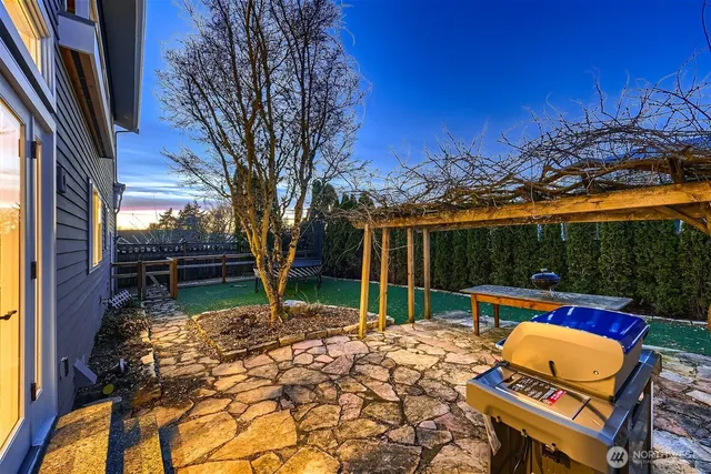 a view of a backyard with sitting area