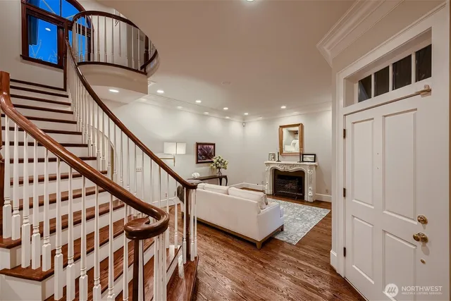 a living room with furniture or wooden floor and a chandelier