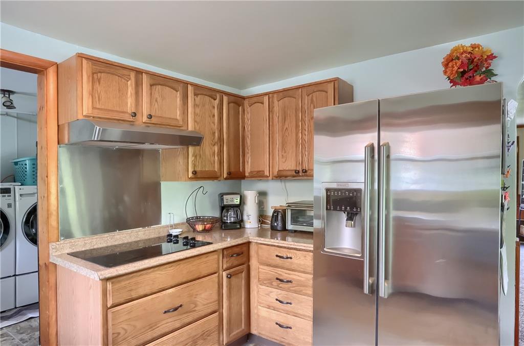 119 Lovi Road Baden, PA 15005 - Photo 15 of 41 a kitchen with a refrigerator sink and cabinets